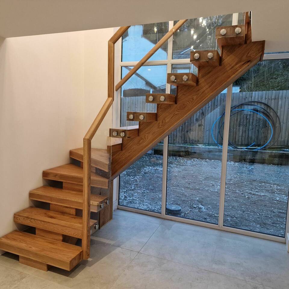 Solid Oak Central String Staircase with Oak Handrail & Glass Panels