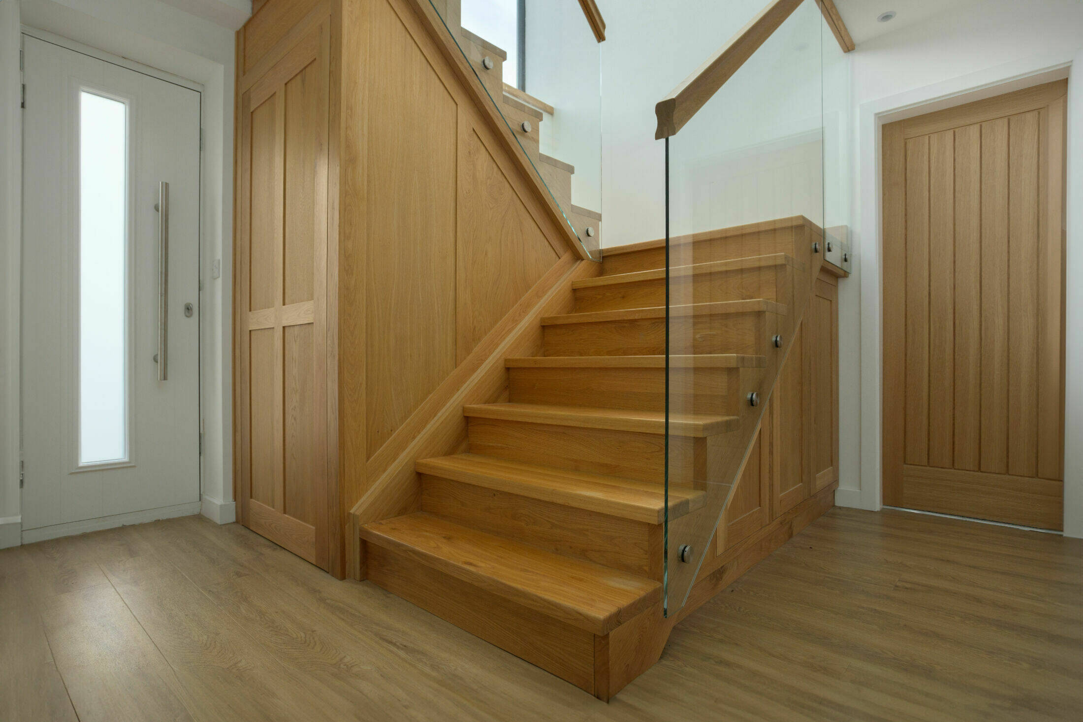 Contemporary Glass and Oak Staircase with Integrated Storage