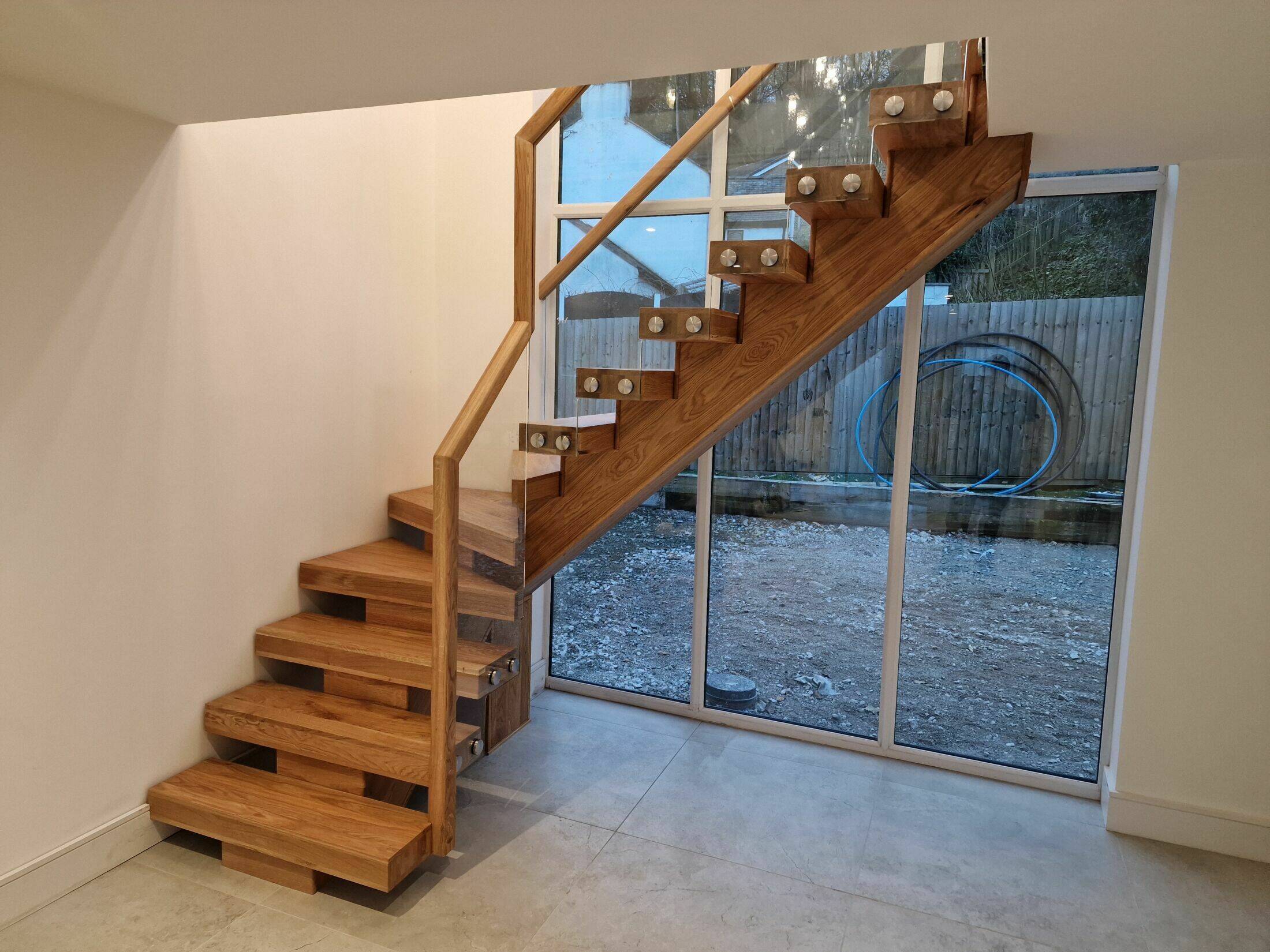 Solid Oak Central String Staircase with Oak Handrail & Glass Panels