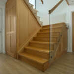 Contemporary glass and oak staircase