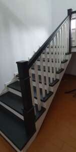 New modern staircase with Victorian-inspired balustrade and oak handrail by Apex Staircases.