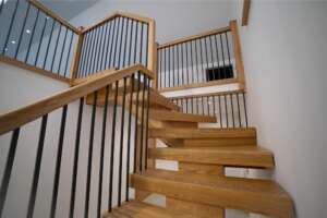 Clean oak staircase in modern UK home – wooden staircase with natural finish.