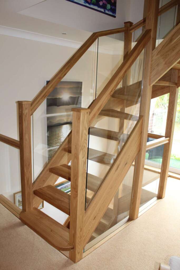 Open riser wooden staircase maximizing natural light.