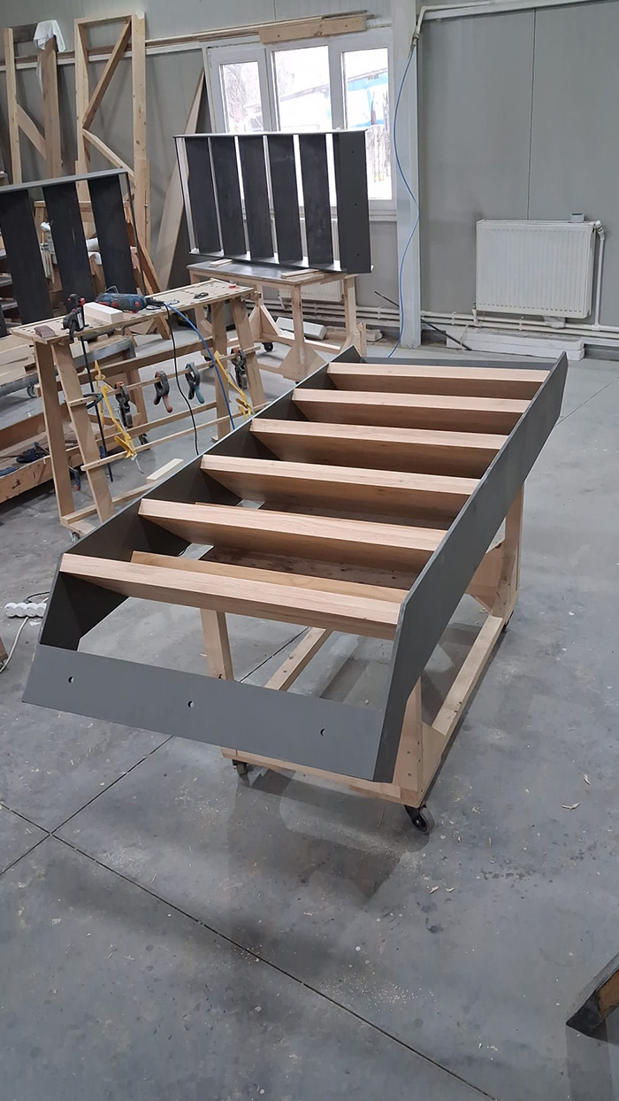 staircase with a metal frame and wooden treads